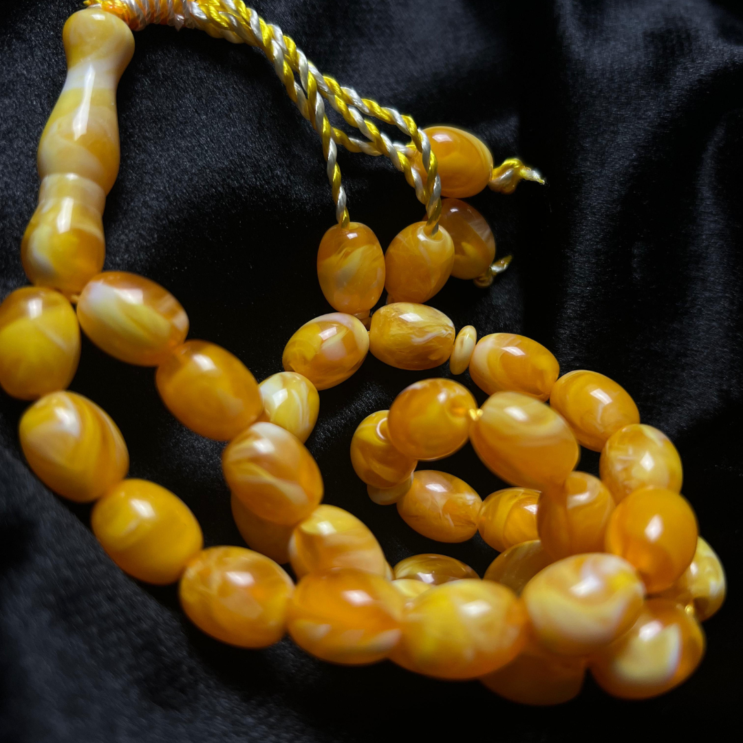 Discover the elegance of our Premium Amber Resin Tasbeeh with 33 beads, crafted for a luxurious prayer experience.